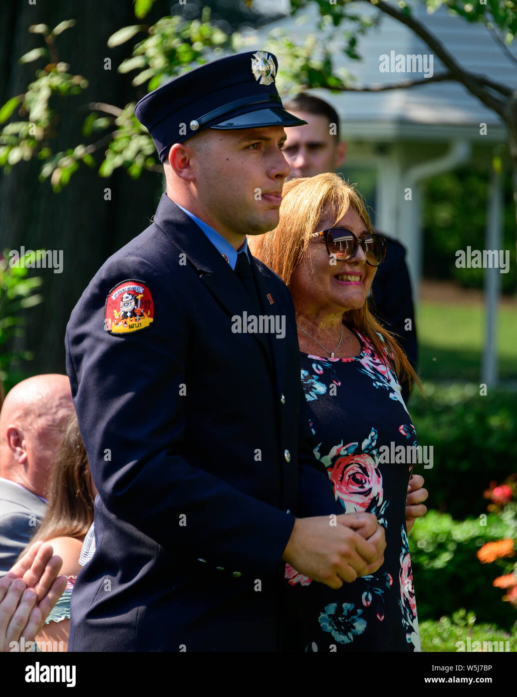 The family of East Meadow Volunteer Firefighter Ray Pfeifer stand after