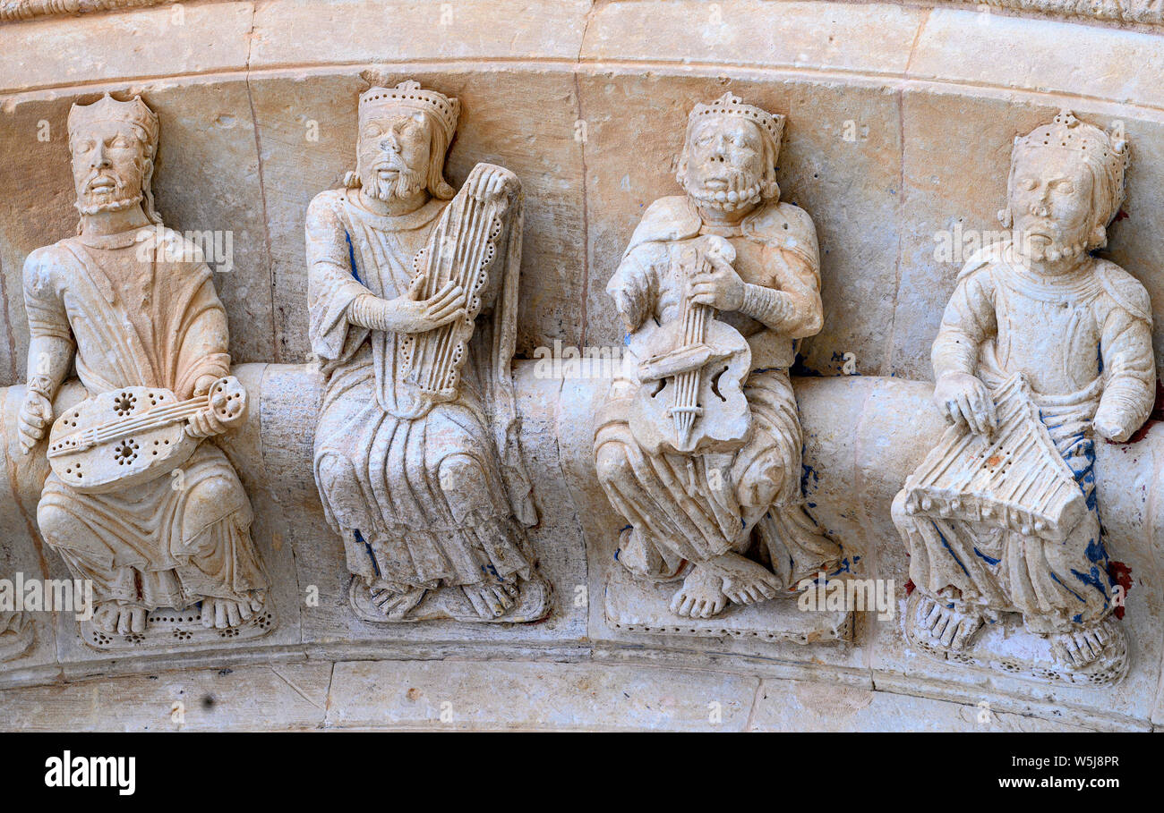 Carved figures of medeival musicians on the 13th century, Romanesque, North door, of the Collegiate church of Santa María la Mayor, Toro, Zamora Provi Stock Photo