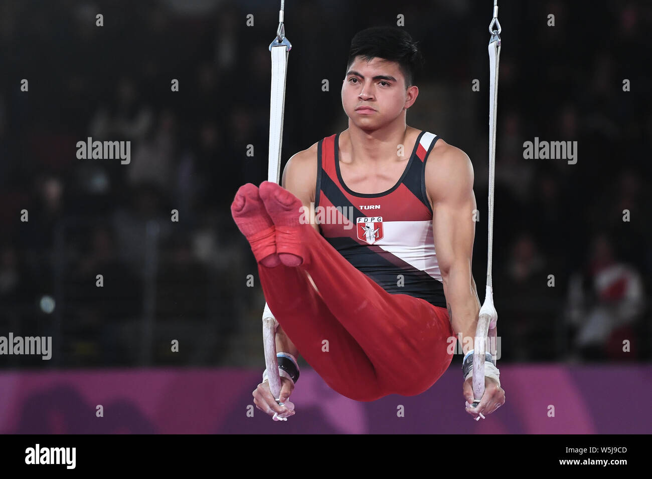 July 28, 2019, Lima, Peru: JESUS MORETO from Peru competes on the still rings during the team finals competition held in the Polideportivo Villa El Salvador in Lima, Peru. Credit: Amy Sanderson/ZUMA Wire/Alamy Live News Stock Photo
