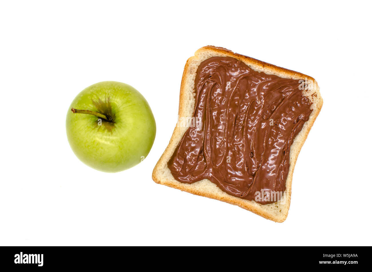 green apple and bread with chocolate nutella paste on a white background isolated Stock Photo