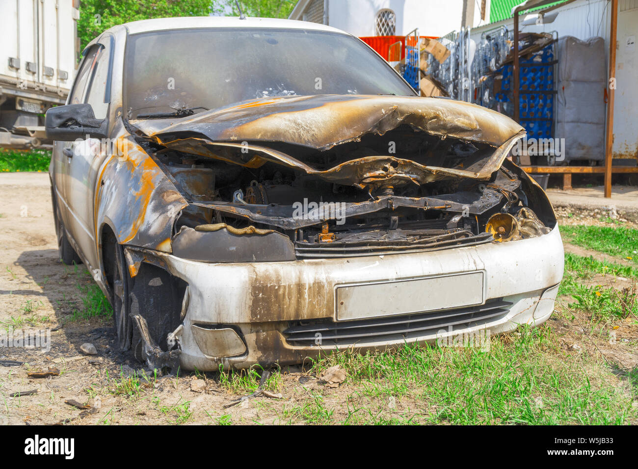 Burnt car on the street Stock Photo - Alamy