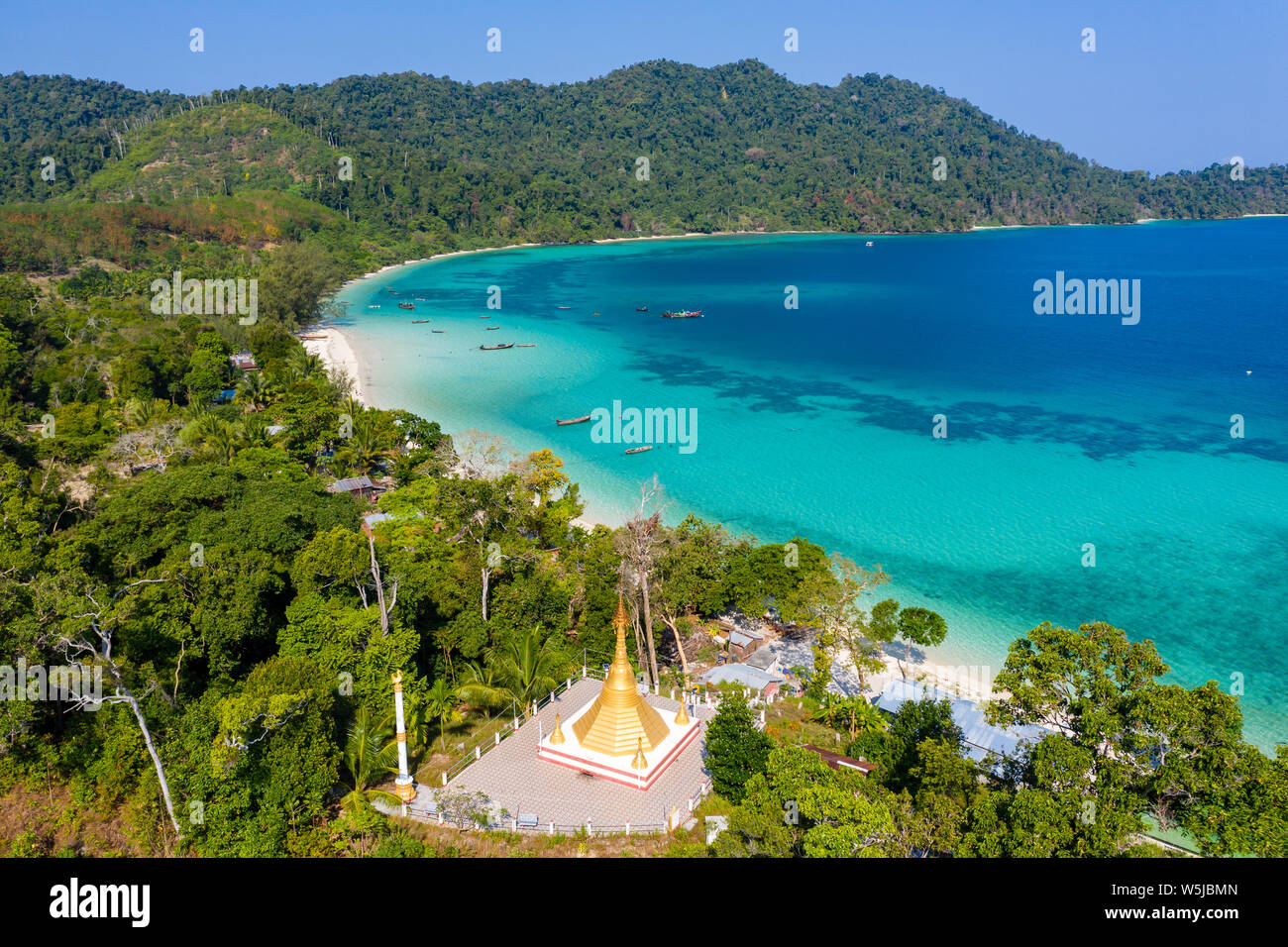 Aerial drone view of a Buddhist shrine on a jungle covered tropical island (Swinton Island, Myanmar) Stock Photo
