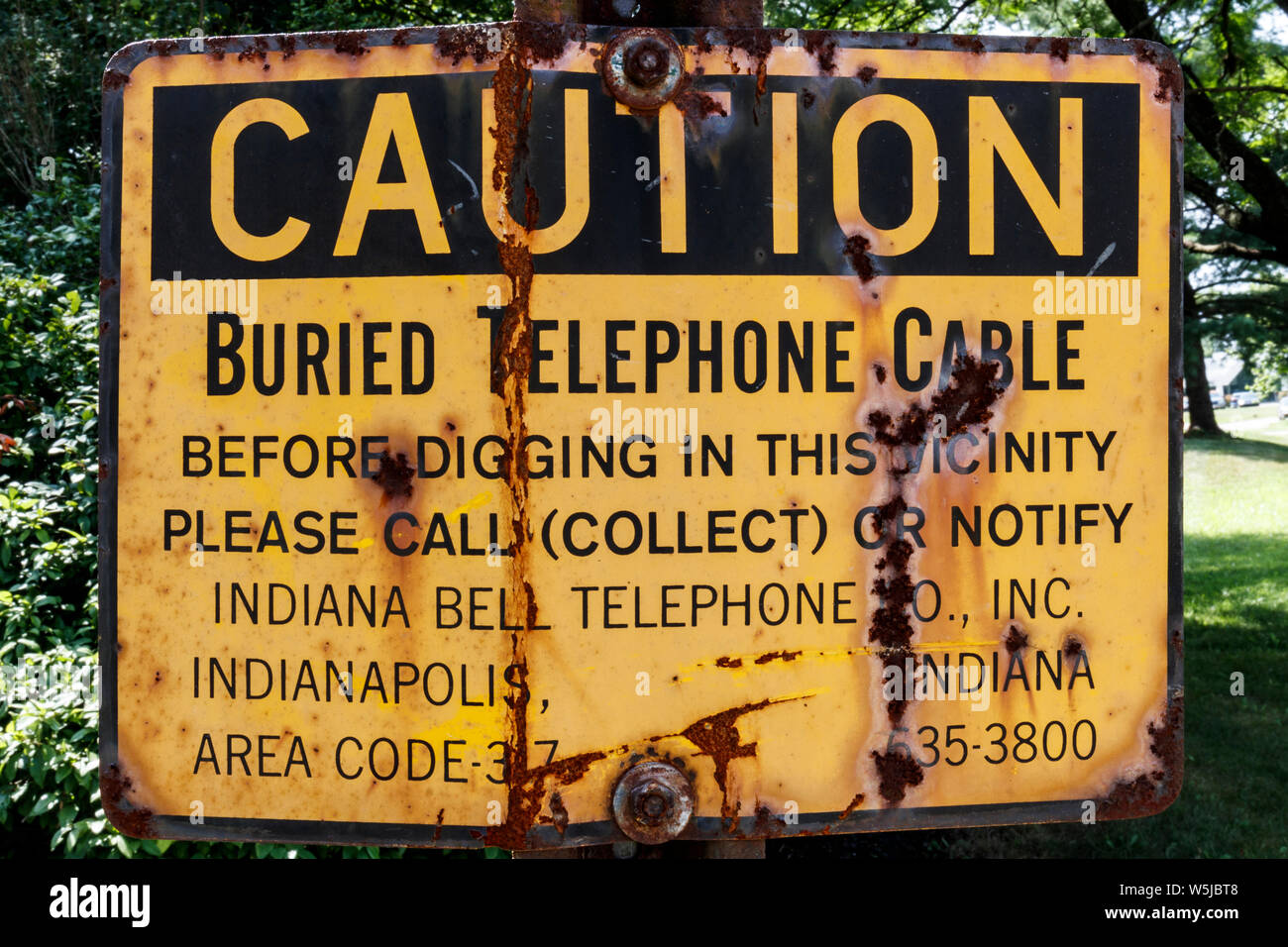Indianapolis - Circa July 2019: Legacy Indiana Bell AT&T warning sign. Before doing business as AT&T, Indiana Bell was combined into Ameritech I Stock Photo