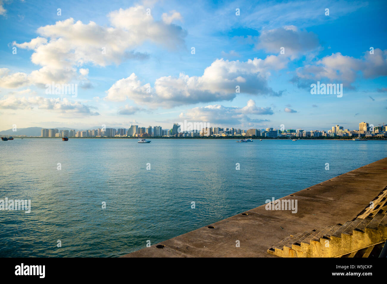 Sanya town evening cityscape, view from Phoenix island on Hainan Island of China Stock Photo