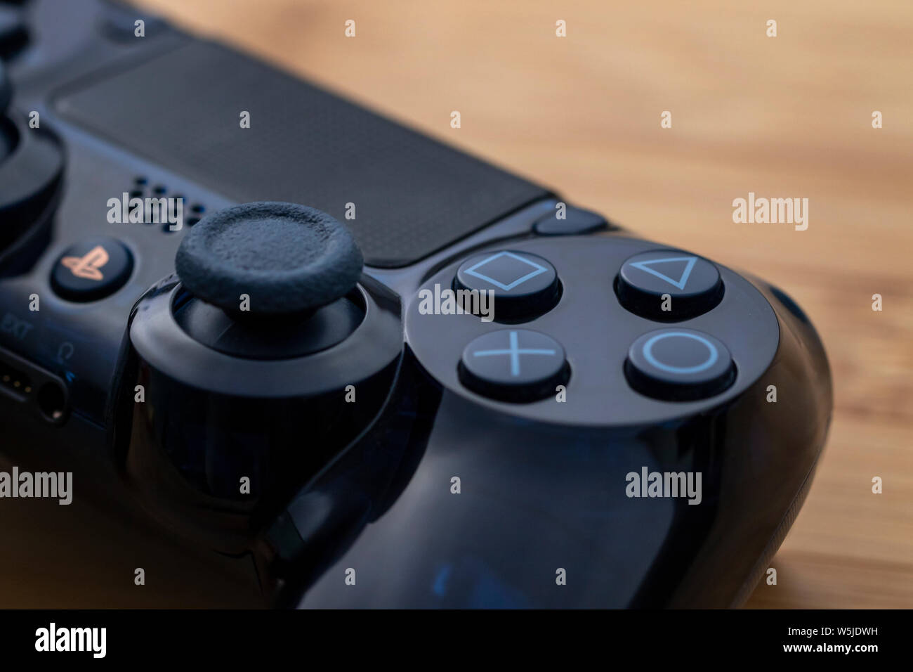 Antwerp, Belgium - July 27 2019:Antwerp, Belgium - July 27 2019: A close up  portrait of a part of a playstation 4 controller. The four iconic buttons  Stock Photo - Alamy
