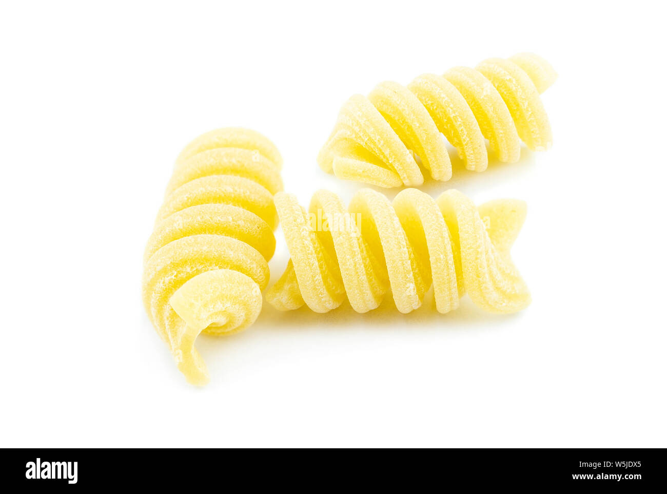 uncooked fusilli pasta noodles isolated on white background Stock Photo