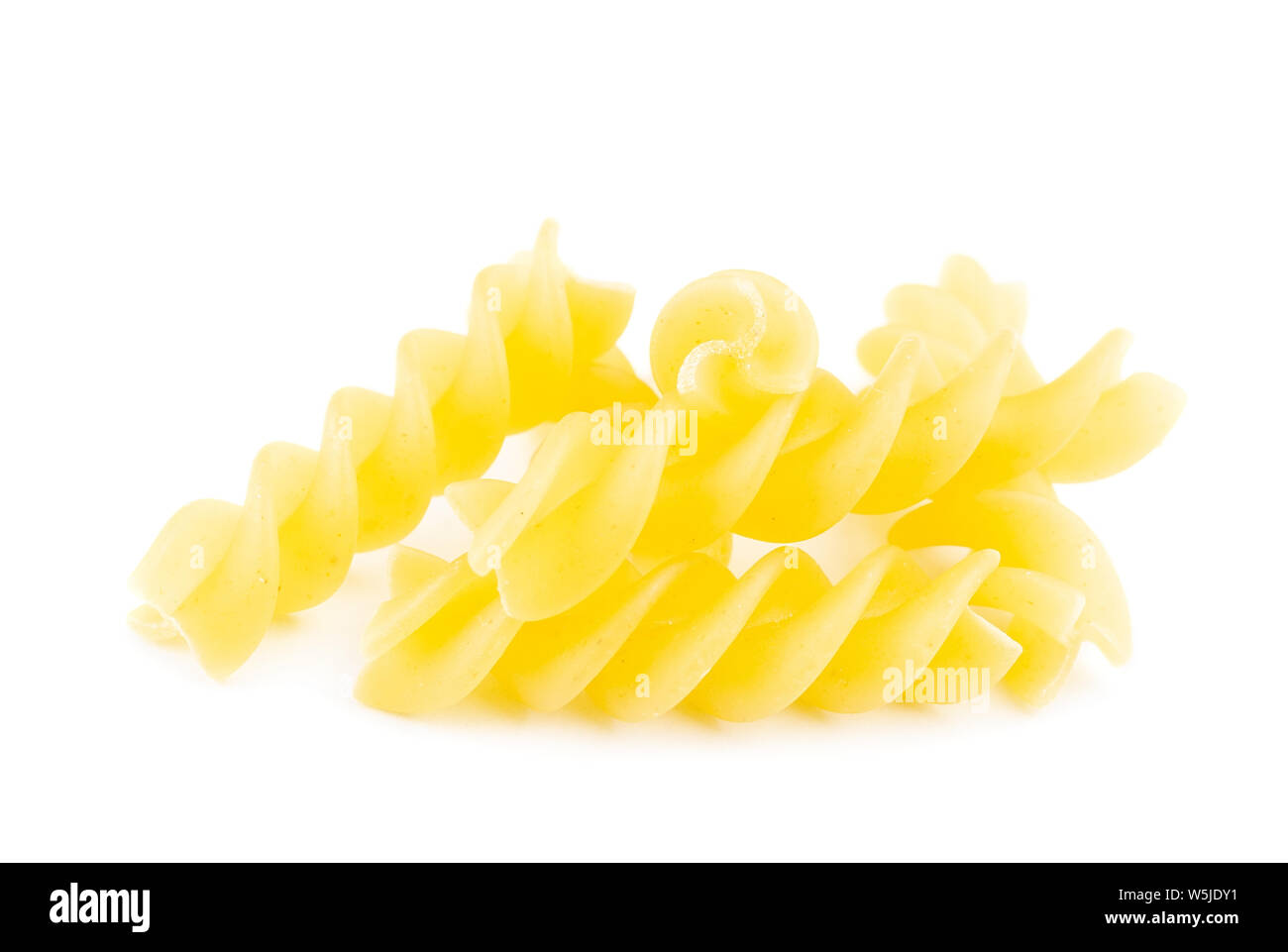 uncooked fusilli pasta noodles isolated on white background Stock Photo