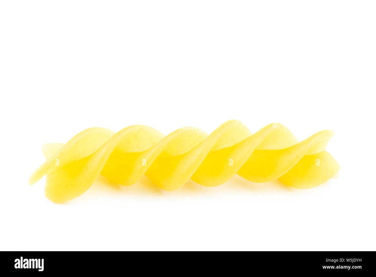 uncooked fusilli pasta noodles isolated on white background Stock Photo