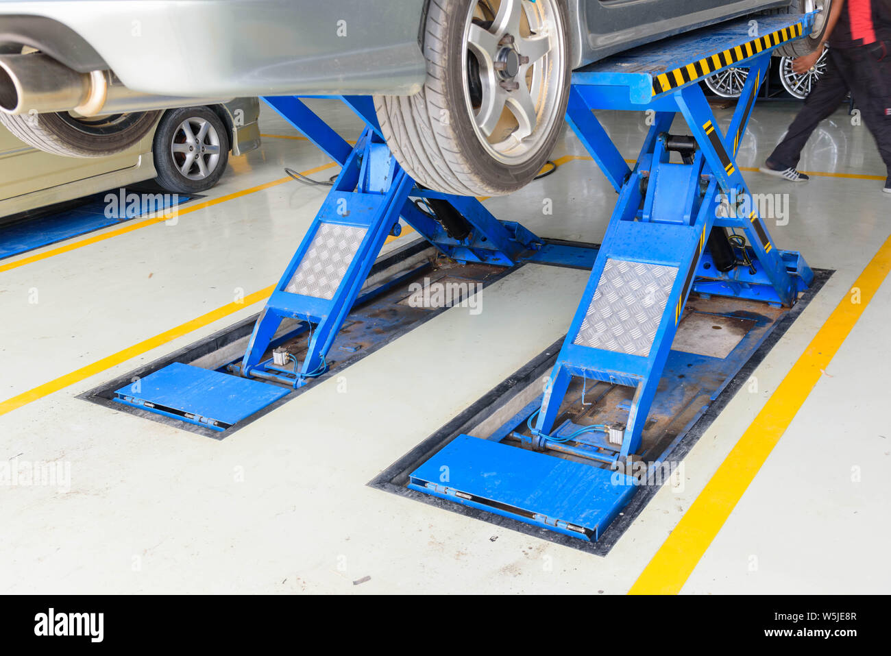Lift the car for Suspension Check for maintenance Stock Photo Alamy