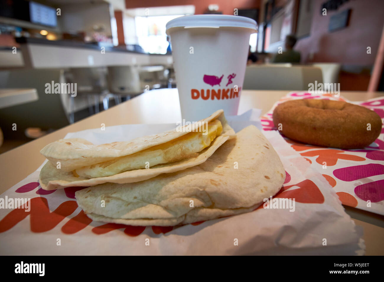 dunkin donuts breakfast egg wraps coffee and traditional ring donut in