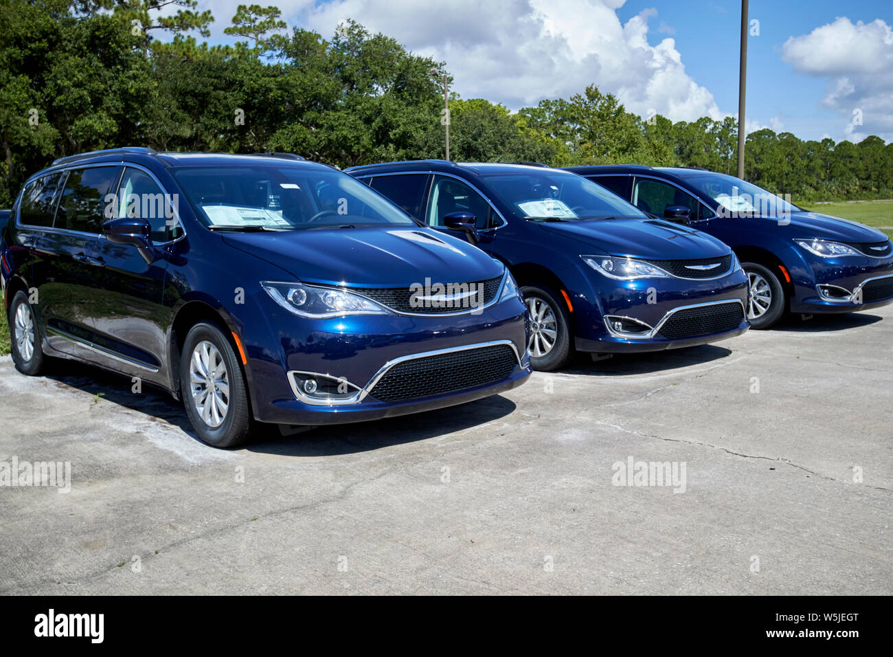 new chrysler minivans for sale vehicles on a car sales lot in florida usa united states of america Stock Photo