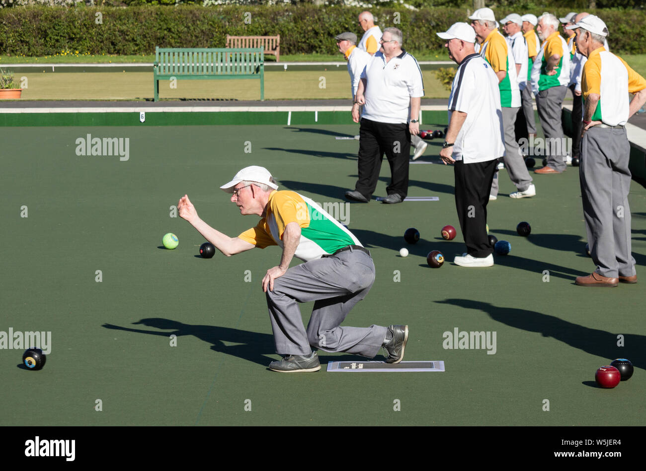 Elderly men playing lawn bowls/bowling, crown green bowling. UK Stock Photo