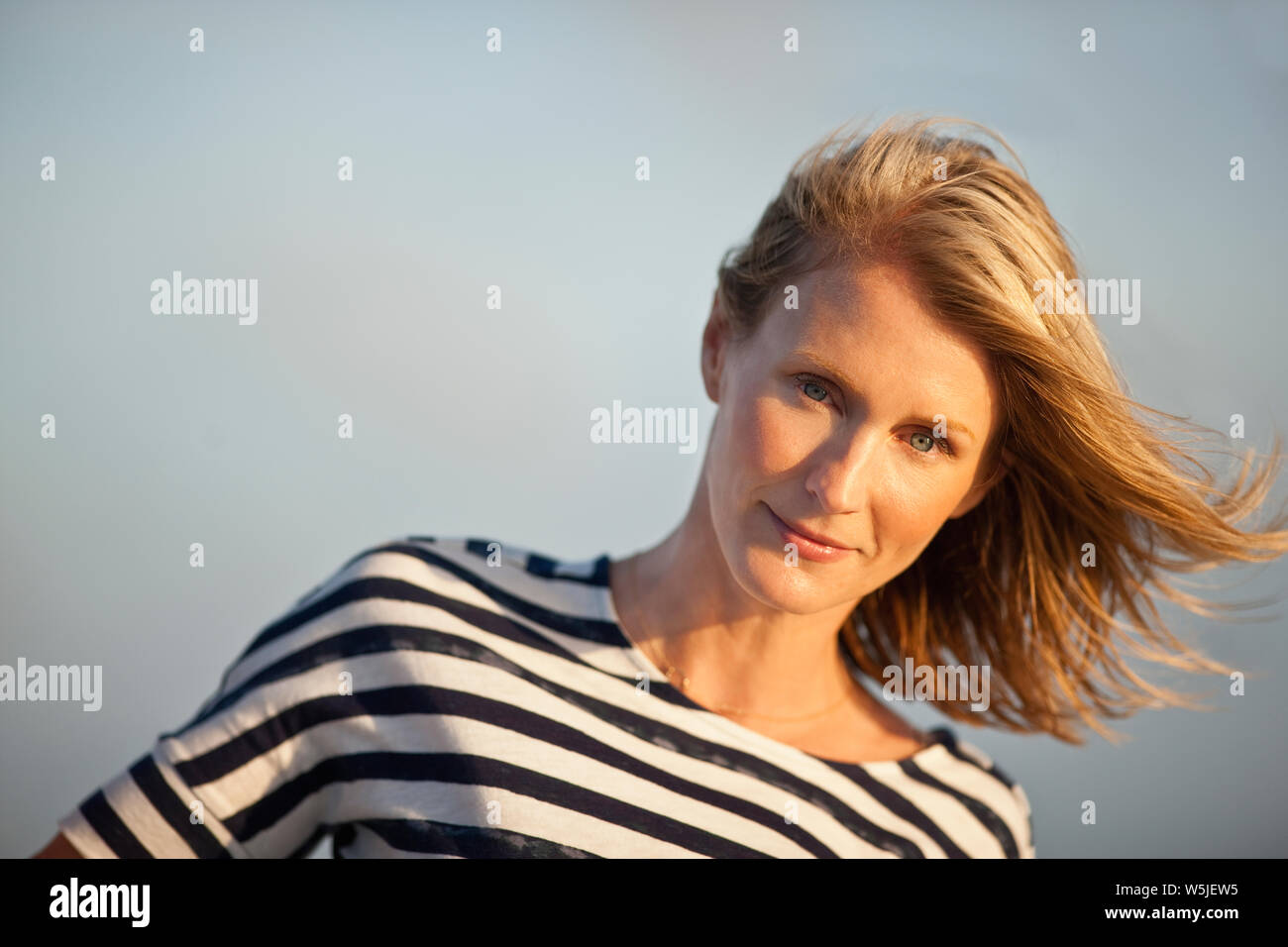 Long Light Brown Wind Swept Middle Part Hair