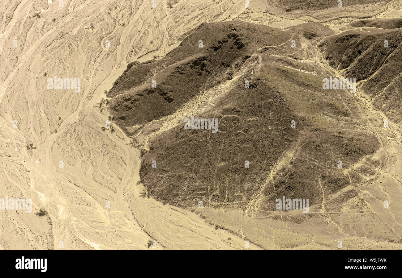 Aerial view of the astronaut geoglyph drawing by the Nazca civilization in the peruvian coastal desert known as the mysterious Nazca Lines, Peru. Stock Photo