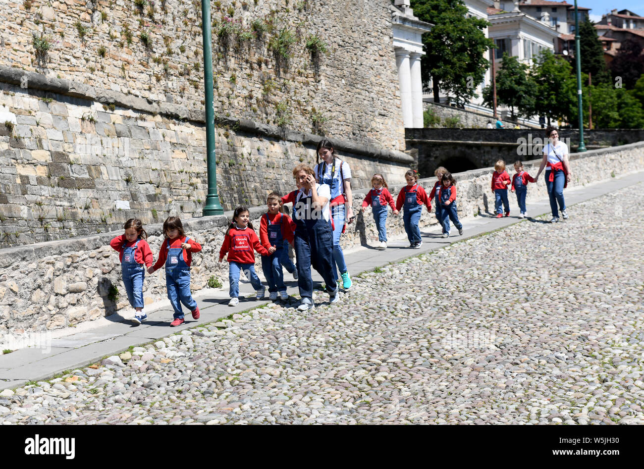 Italian school children on day out in Bergamo, Lombardy, Italy Stock Photo