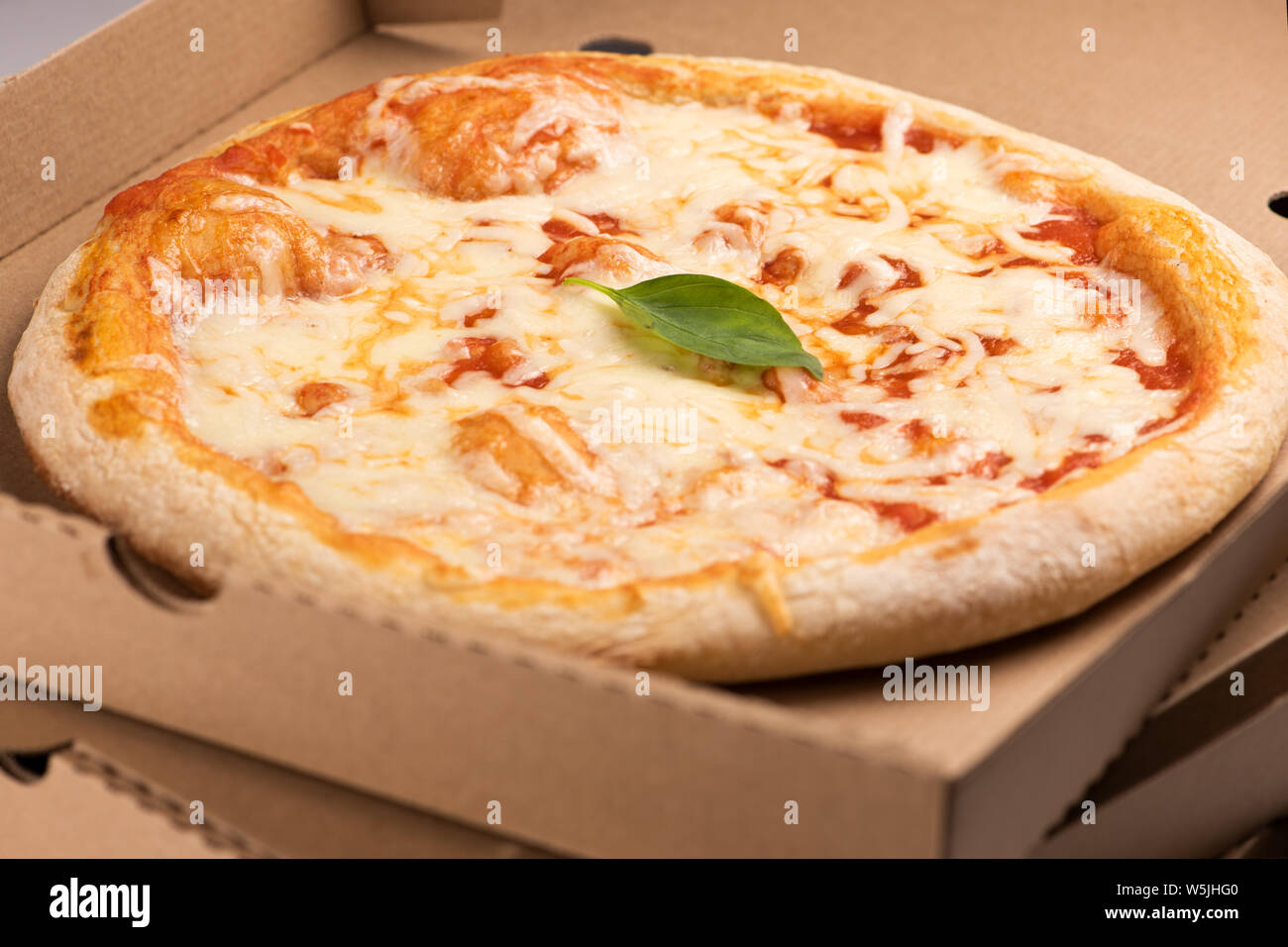 Pizza delivery. Pizza menu, pizza margherita on box for take away or delivery Stock Photo