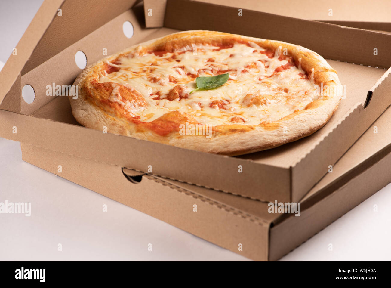 Pizza delivery. Pizza menu, pizza margherita on box for take away or delivery Stock Photo