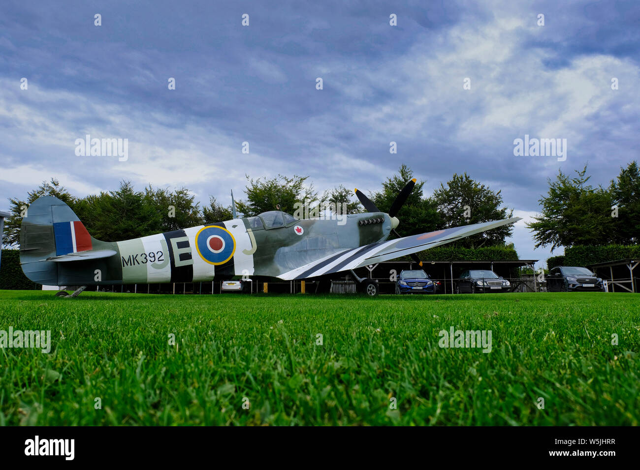A wooden replica of Johnnie Johnson's Spitfire MK392. It is stored outside the Boultbee Flight Academy at Goodwood Aerodrome. Stock Photo