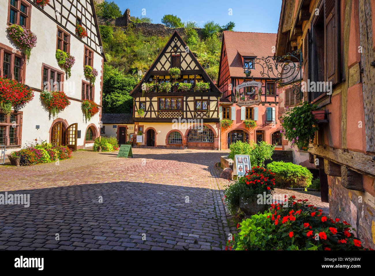 picturesque square with half-timbered houses in the historical old town of Kaysersberg, Alsace, Wine Route, France, popular touristy destination Stock Photo