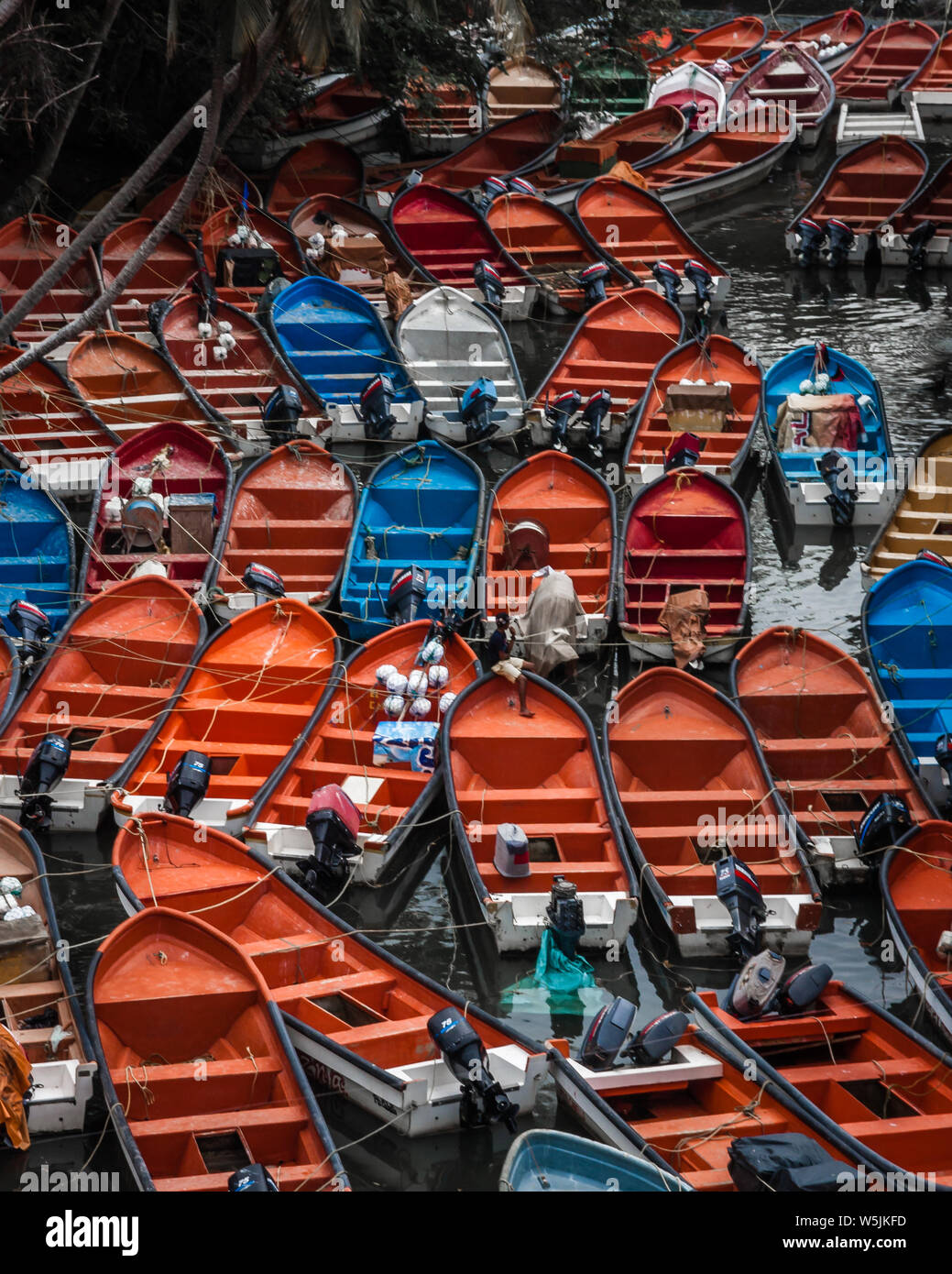 Brightly coloured fishing boats on the embarkadero in Puerto Colombia ...