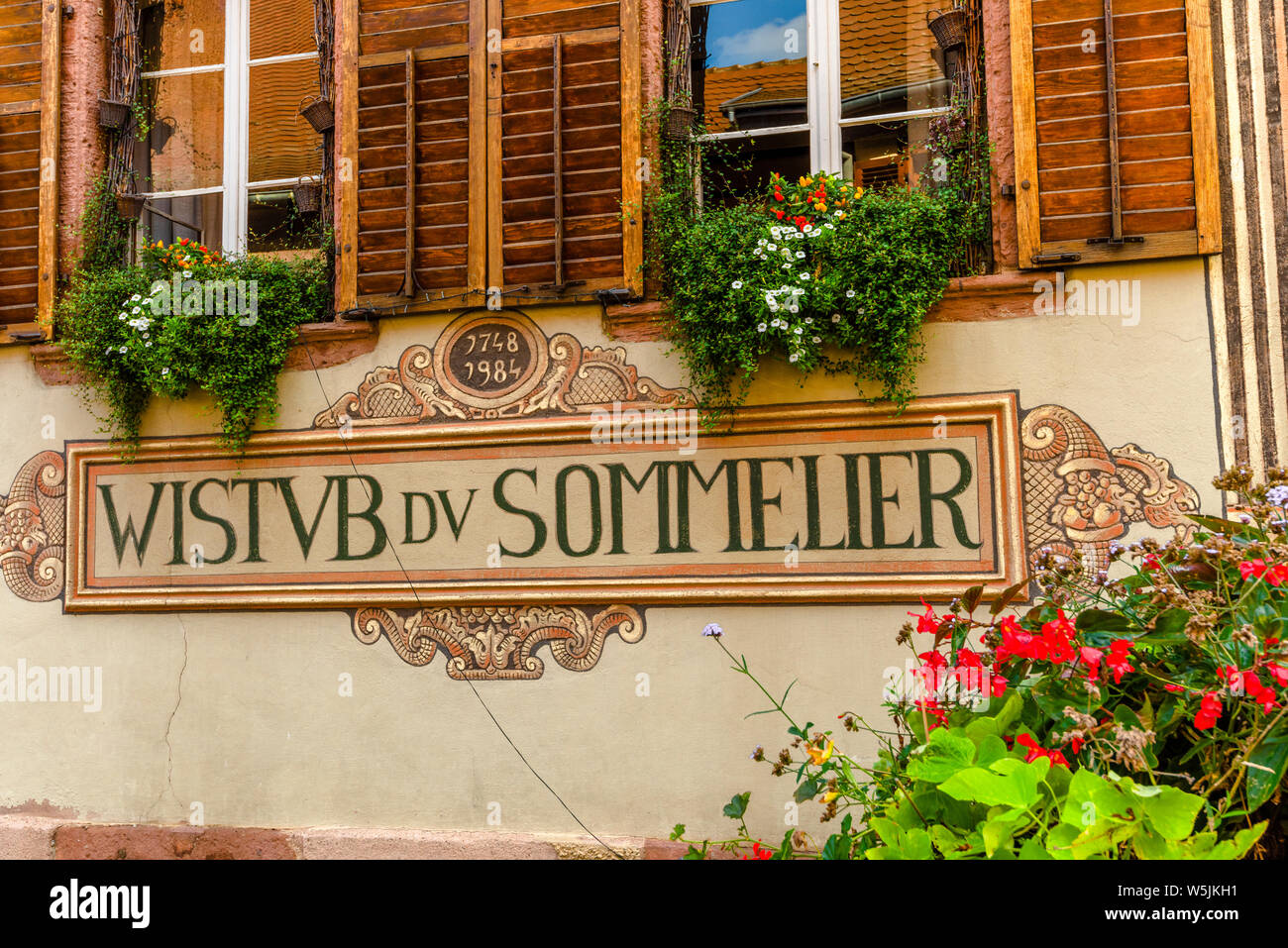guest house with paintings in the old village Bergheim, Alsace Wine Route, France Stock Photo