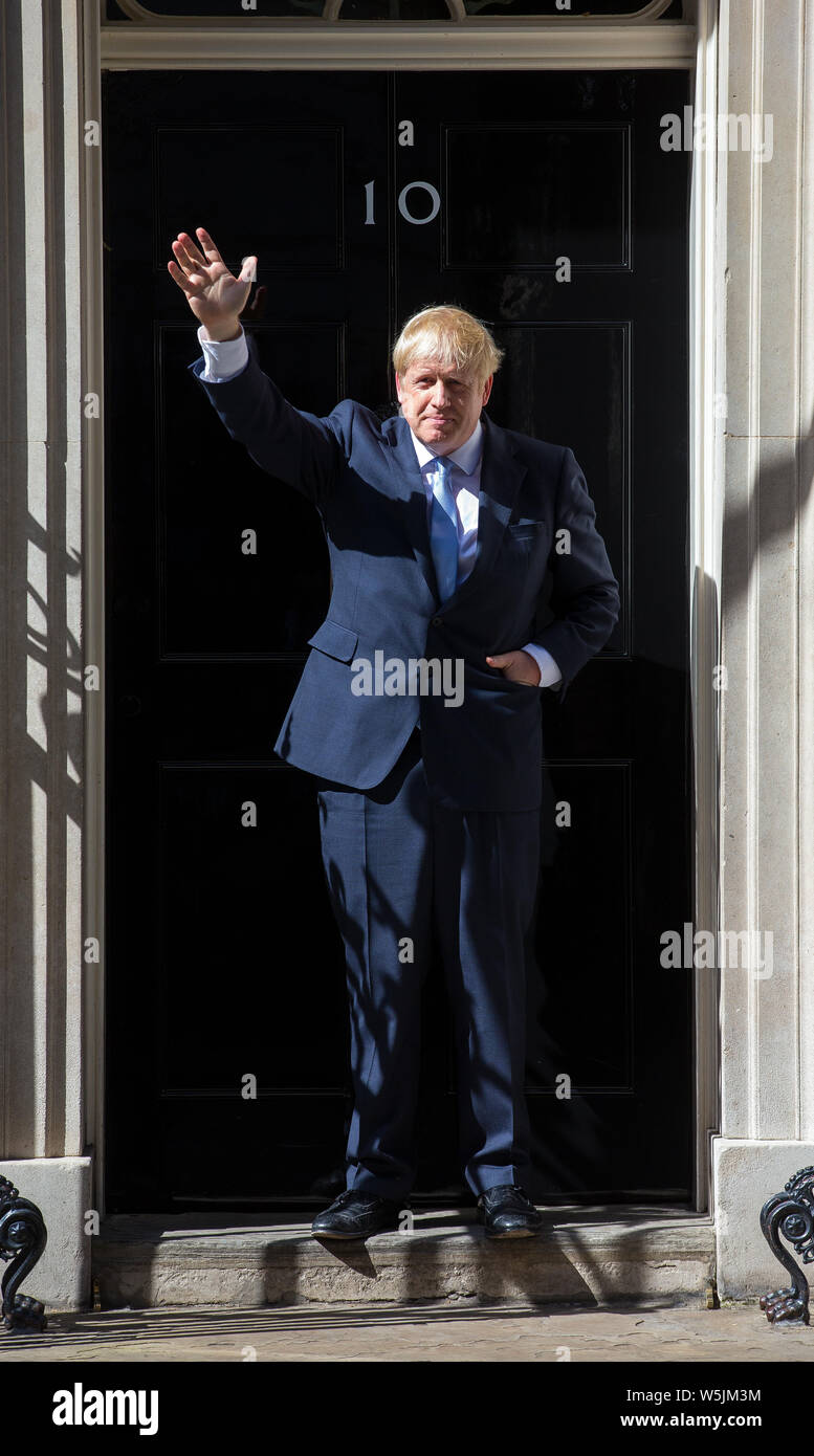 Boris Johnson waves on the step of number 10 Downing Street on the day he officially becomes Prime Minister Stock Photo
