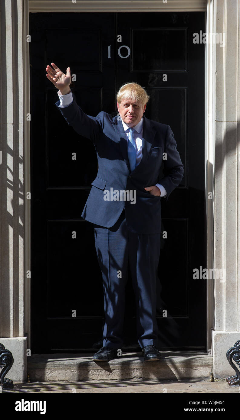 Boris Johnson waves on the step of number 10 Downing Street on the day he officially becomes Prime Minister Stock Photo