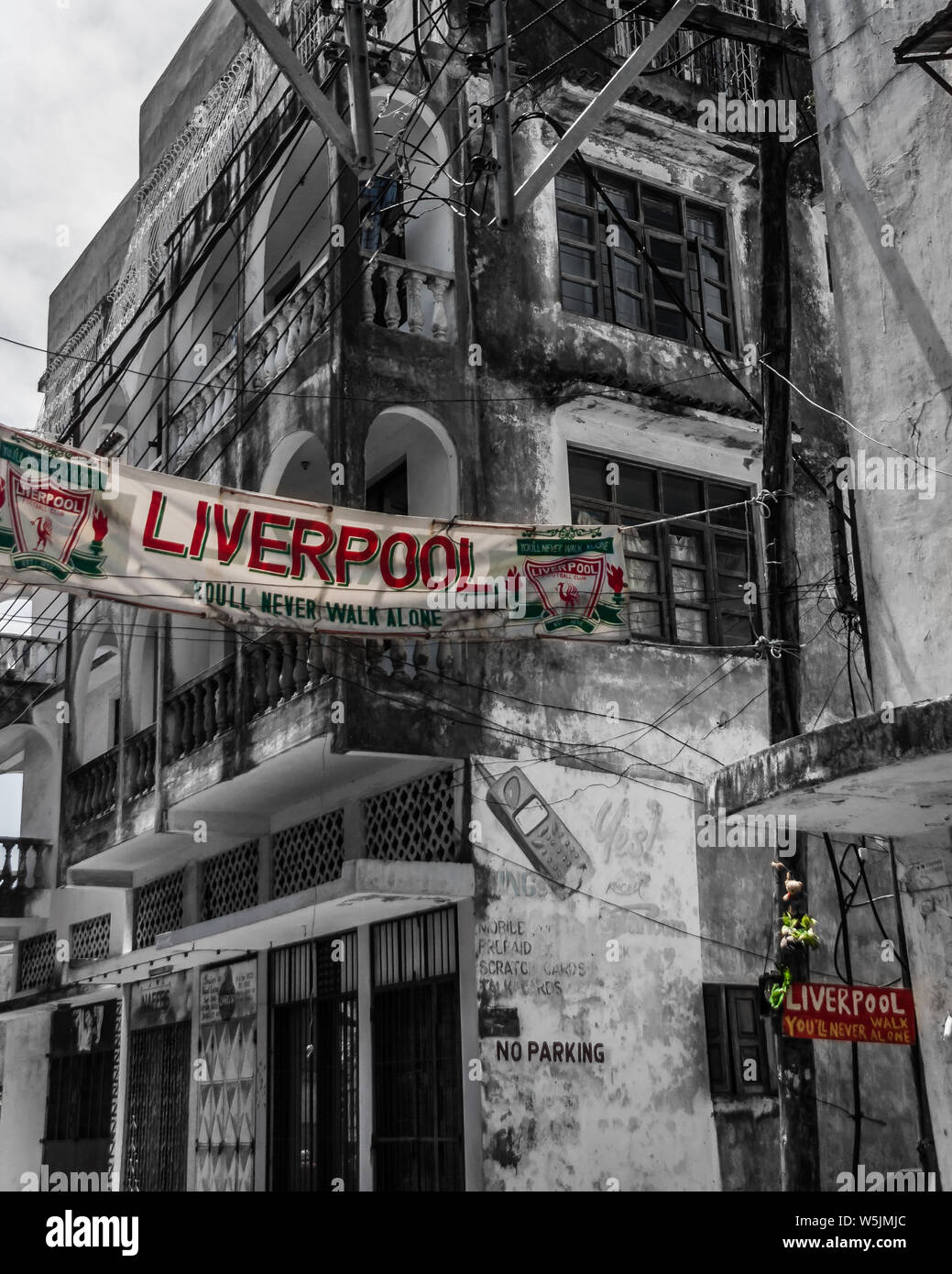 May 1, 2009. A Liverpool FC sign on a dilapidated building in the old city of Mombasa in Kenya Stock Photo