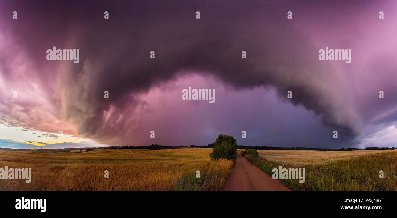 Panorama of Storm clouds with shelf cloud and intense rain Stock Photo