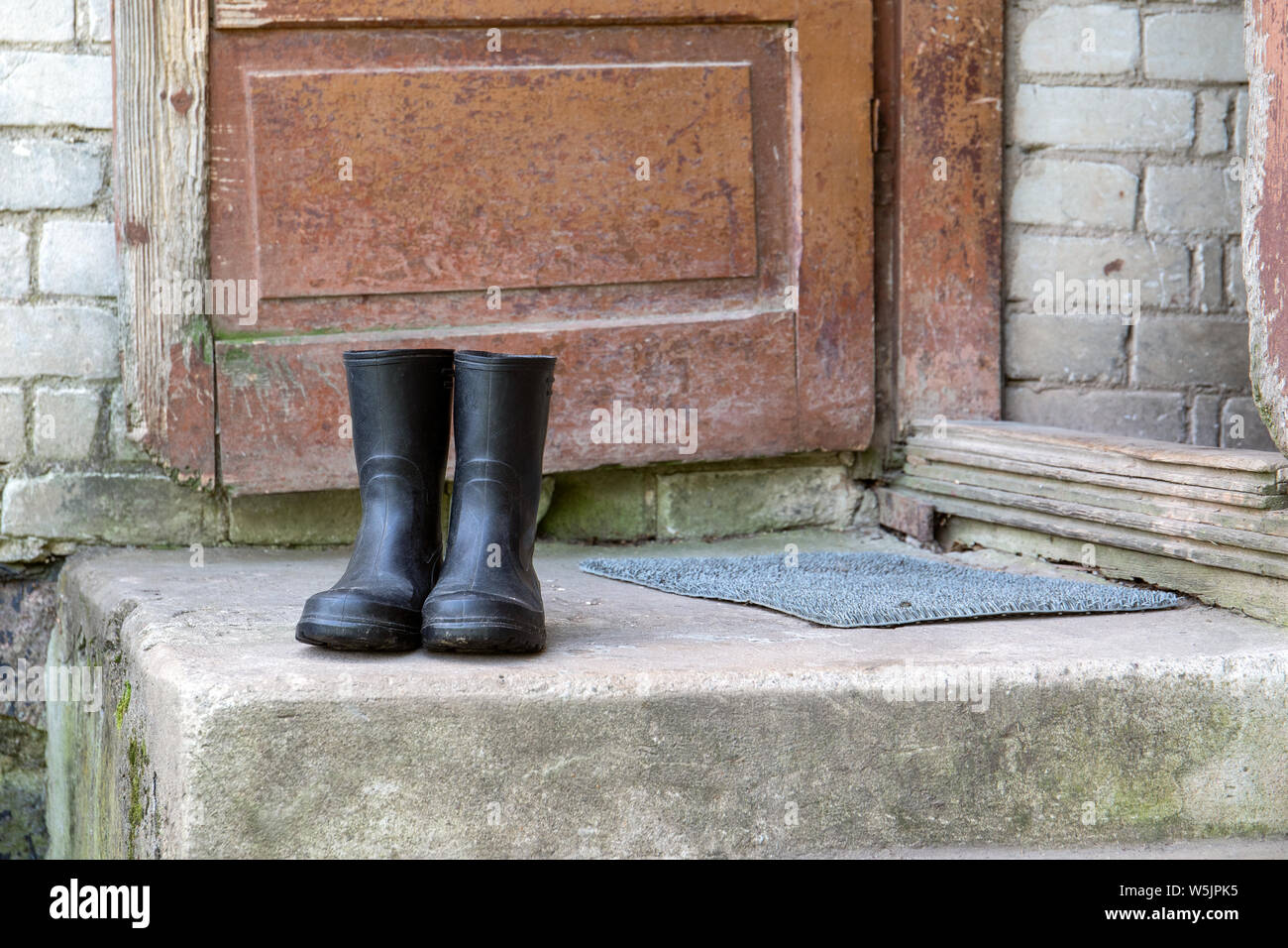 Rubber boots on concrete stairs Stock Photo Alamy