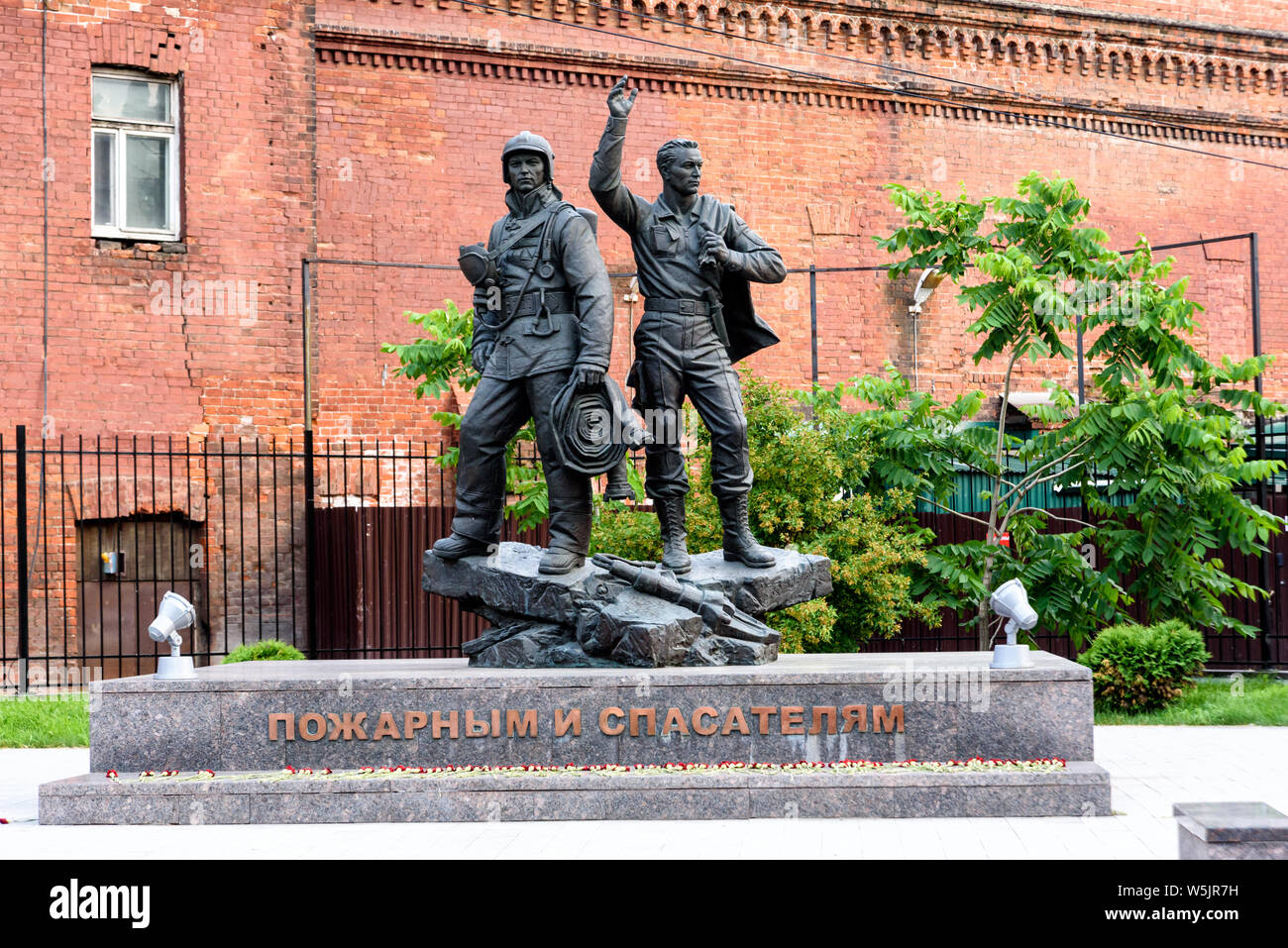 IRKUTSK, RUSSIA - JULY 6, 2019: Sculpture of firemen and rescuers Russia in Irkutsk region, Irkutsk, Krasnoarmeyskaya street Stock Photo