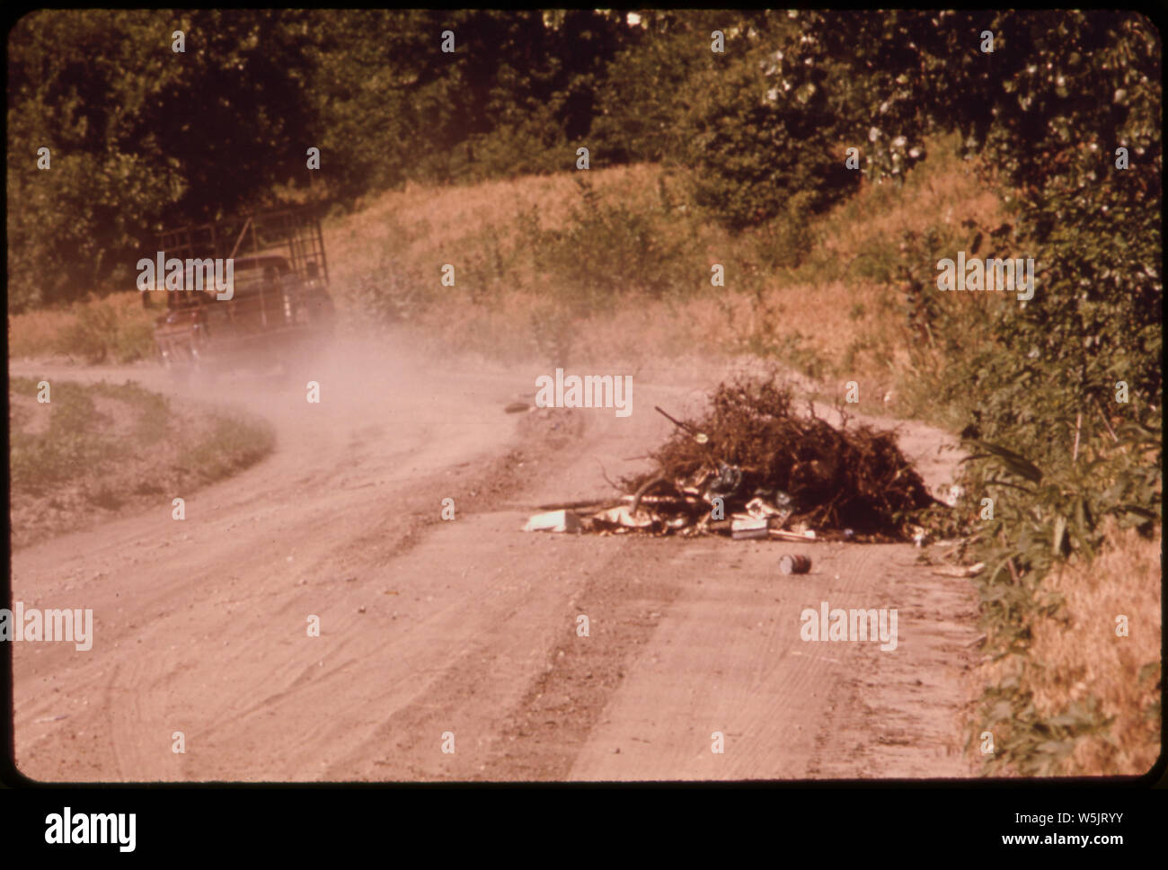 ANONYMOUS DRIVER DUMPS A PICK-UP LOAD OF TRASH ON A FARM ROAD NEAR BONNER SPRINGS Stock Photo