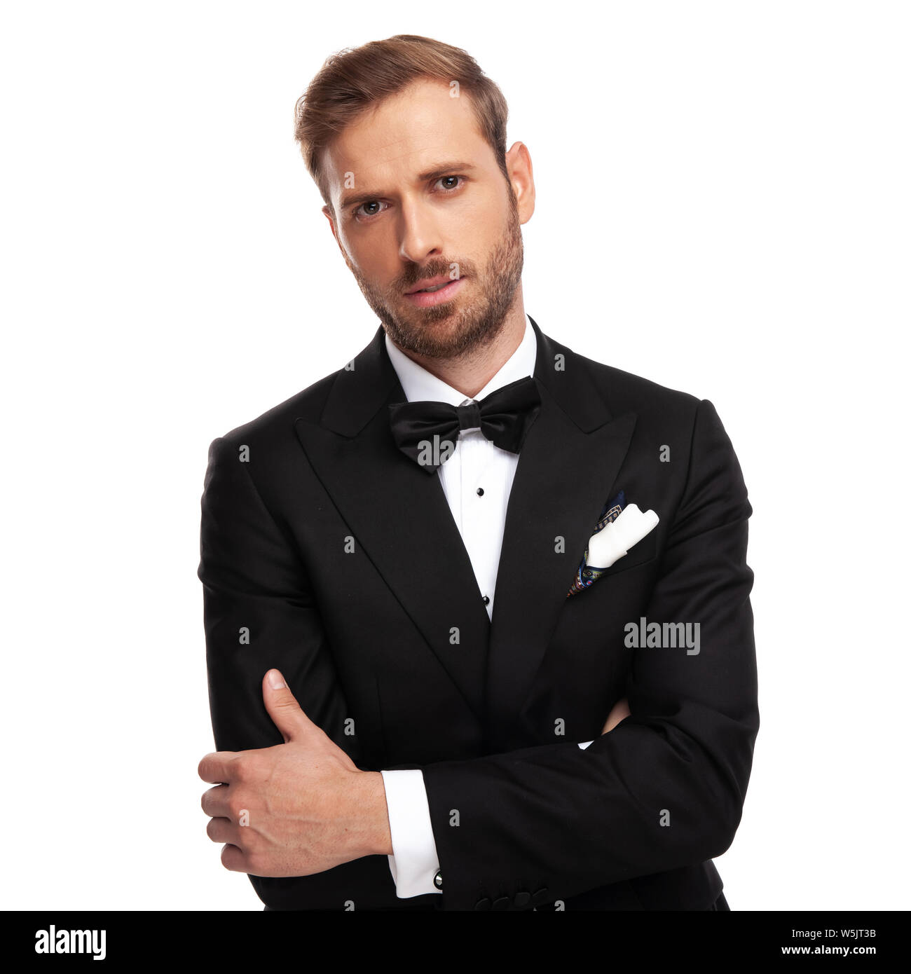 portrait of confident businessman in black suit standing on white ...