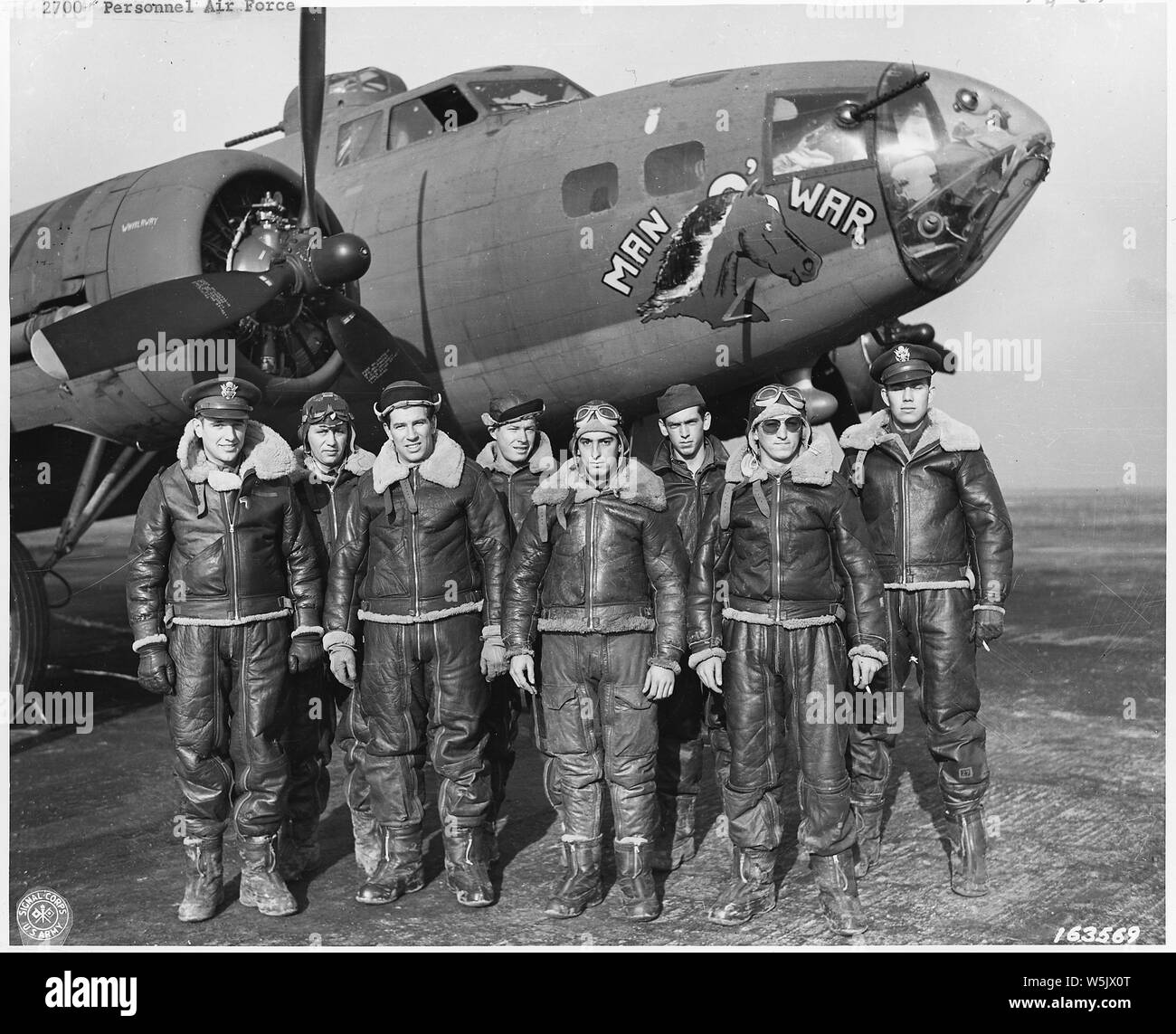 Air Force personnel & equipment. The Pacific, England, Wash. DC. 1942-44 (mostly 1943); Scope and content:  U.S. Bomber crew somwhere in England. Lt. J.M. Stewart, Marrowbone, Ky., Lt. W.W. Dickey, Beverly, Mass., S/Sgt. R.C. Schnoyer, East Greenville, Pa., S/Sgt. H.L. Langan, Los Angeles, Calif., T.E. McMillan, Boonville, Oh., T/Sgt. C.J. Merriwether, Sanford, Fla., T/Sgt. Jack M. Wheeler, Des Moines, Ia., Lt. J.A. Creamer, Louisville, Ky. 367 Bomber Squad. Thurleigh, England. General notes:  The crew of the Boeing B-17F-5-BO Fortress (s/n 41-24399) Man-O-War from the 323rd Bomb Squadron, 91s Stock Photo