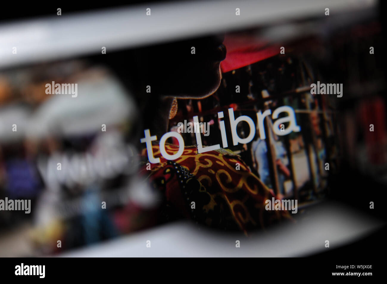 The Libra cryptocurrency website seen through a magnifying glass, Libra is being developed by Facebook Inc. Stock Photo