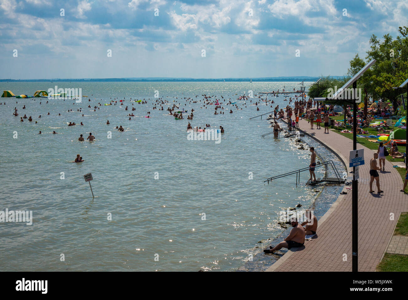 Vonyarcvashegy, BALATON, HUNGARY - July 27, 2019: people swimming in blue lake Balaton summertime Stock Photo