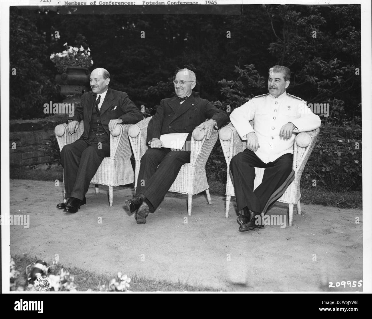 American and Allied leaders at international conferences; Scope and content:  The Big Three. Enjoying a brief respite during the last day of the Berlin conference are, Prime Minister Clement R. Attlee, President Harry S. Truman, and Generalissimo Josef Stalin. 08/01/45. Stock Photo