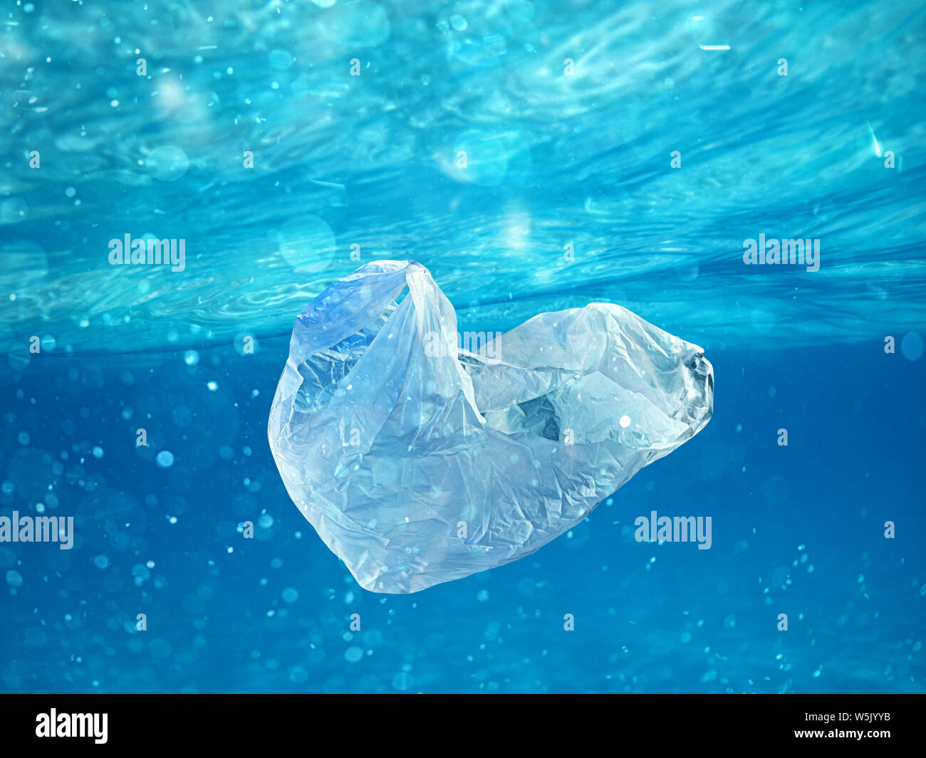 Floating bag. Problem of plastic pollution under the sea concept. Stock Photo