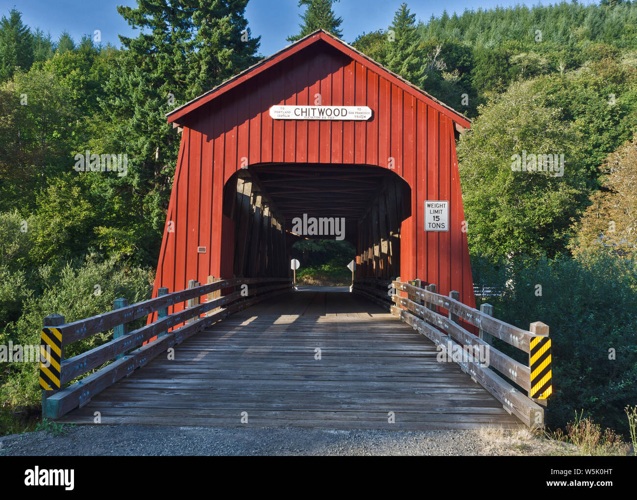 OR: Lincoln County, Coast Range, Chitwood Covered Bridge. Red covered bridge, over the Yaquina River at Chitwood, built 1920.. Stock Photo