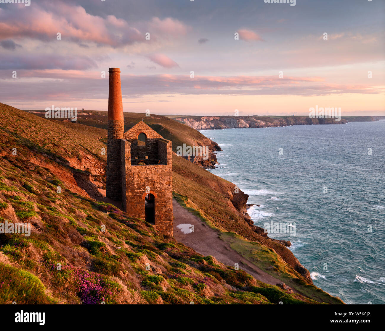 Towanroath Shaft Pumping Engine House ruins at Wheal Coates tine mine on the cliffs of Celtic Sea Cornwall England with Great Wheal Charlotte Stock Photo