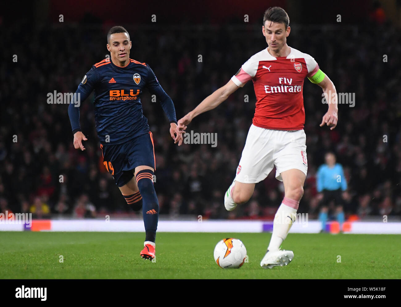 LONDON, ENGLAND - MAY 2, 2019: Rodrigo Moreno Machado of Valencia and Laurent Koscielny of Arsenal pictured during the first leg of the 2018/19 UEFA Europa League Semi-finals game between Arsenal FC (England) and Valencia CF (Spain) at Emirates Stadium. Stock Photo