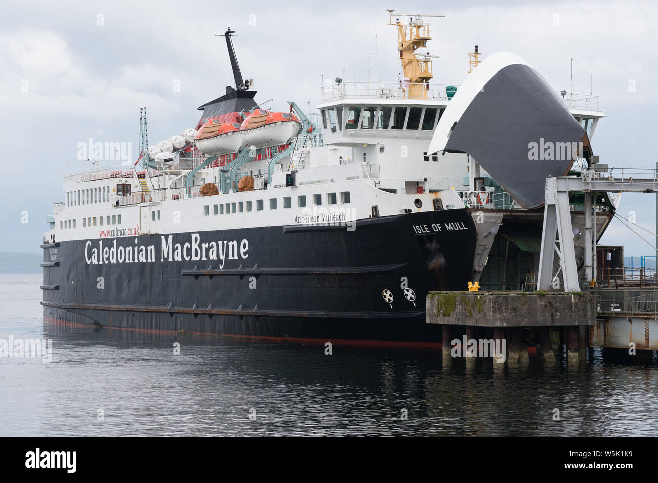 Caledonian Macbrayne ferry with open bow door loading cars at a Craignure port on the Isle of Mull, Scotland. Ferry was travelling to to Oban. Stock Photo