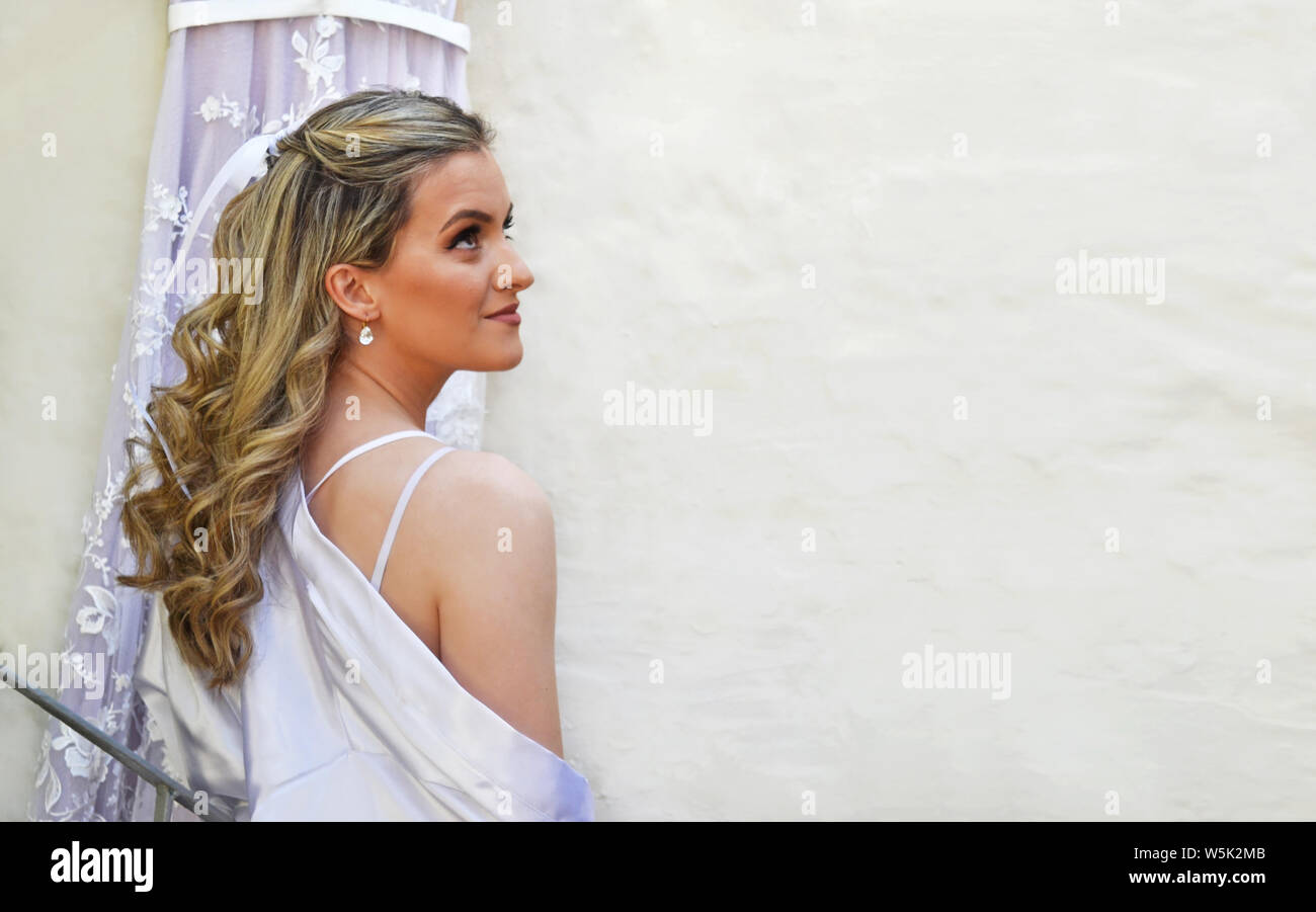 Beautiful Bride Profile In Front Of Her Wedding Dress Bridal