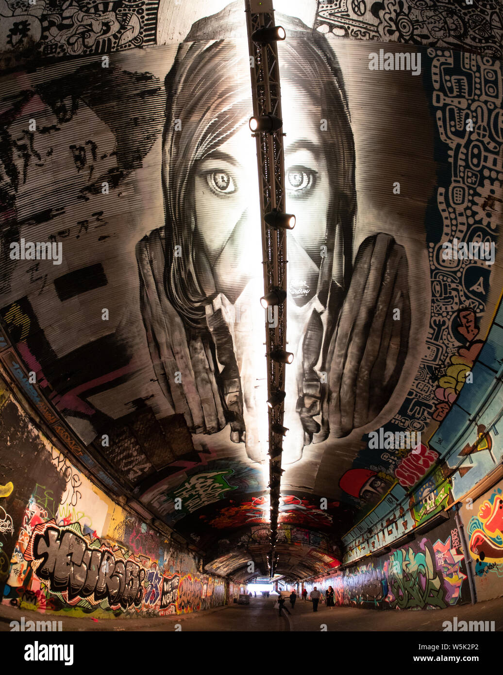 Graffiti in the Leake Street tunnel, Waterloo, London, including a large mural on the ceiling Stock Photo