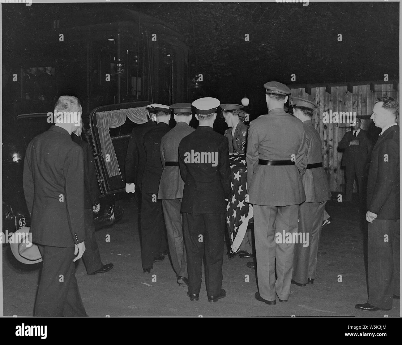 Bearers put the casket of President Franklin D. Roosevelt into a hearse