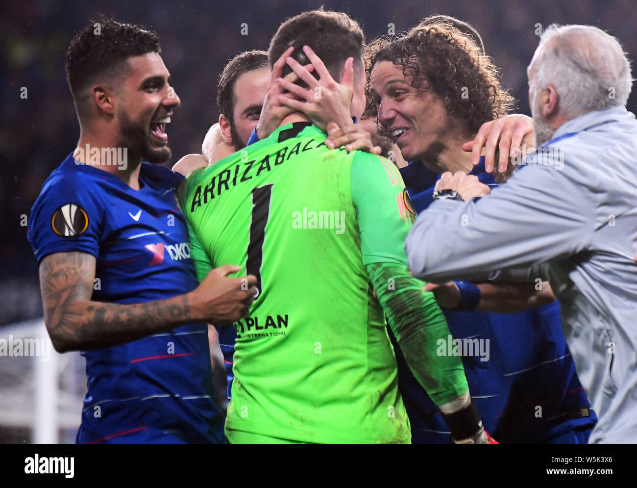 LONDON, ENGLAND - MAY 9, 2019: Emerson Palmieri dos Santos of Chelsea (L), Kepa Arrizabalaga of Chelsea (C) and David Luiz of Chelsea (R) celebrate after the second leg of the 2018/19 UEFA Europa League Semi-Finals game between Chelsea FC (England) and Eintracht Frankfurt e.V. (Germany) at Stamford Bridge. Stock Photo