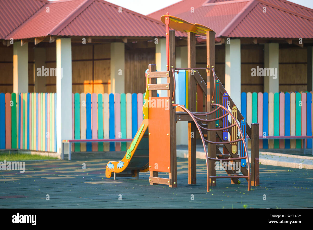 Nursery Playground With Colorful Slides On Soft Rubber Flooring