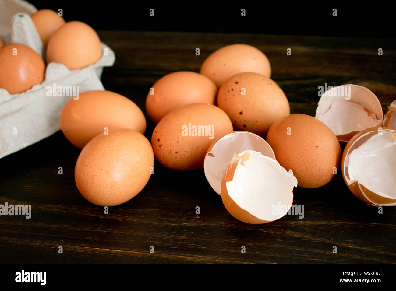 Brown Eggs and Eggshells on a Wood Table Stock Photo
