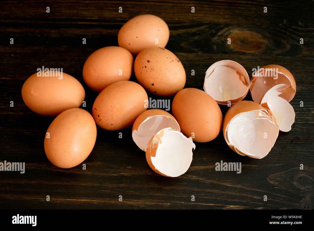 Brown Eggs and Eggshells on a Wood Table Stock Photo