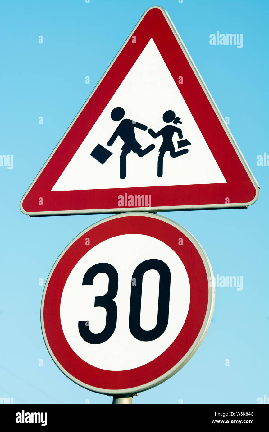 Road traffic sign caution children, 30 km speed limit sign near the school Stock Photo